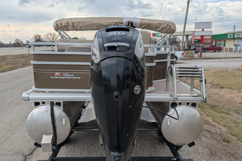Slide: The Image of 2025 Sun Tracker SportFish 20 DLX pontoon boat with Mercury outboard motor. - 85