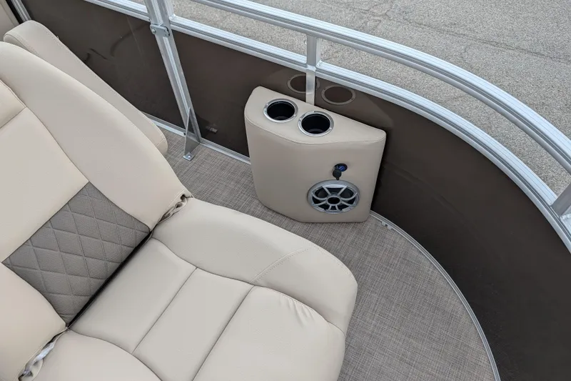 Slide: The Image of 2025 Sun Tracker SportFish 20 DLX interior with beige seating and cup holders. - 93