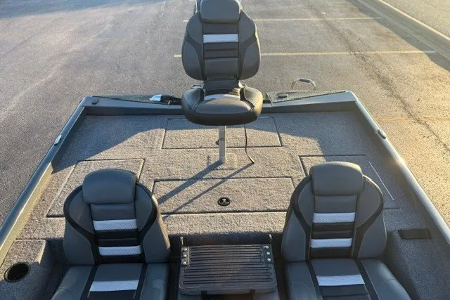 Slide: The Image of 2025 Ranger RT198P boat interior with three cushioned seats and carpeted deck. - 21