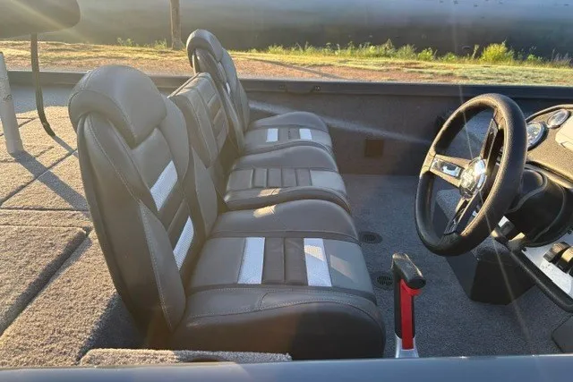 Slide: The Image of 2025 Ranger RT198P boat interior with three black seats and steering wheel. - 26