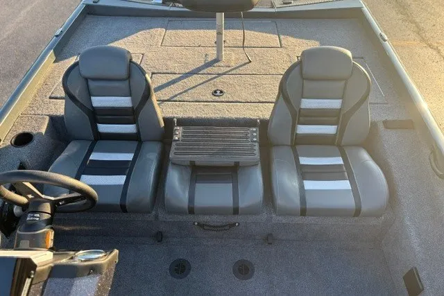 Slide: The Image of 2025 Ranger RT198P boat interior with dual seats and steering wheel. - 18