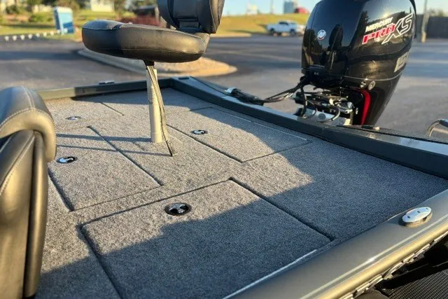 Slide: The Image of 2025 Ranger RT198P fishing boat deck with seating and powerful outboard motor. - 14