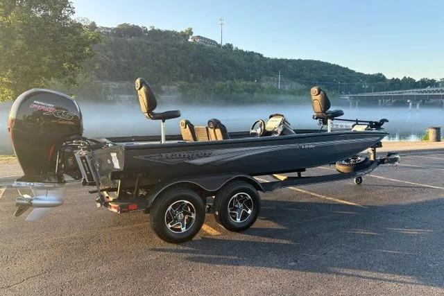 Slide: The Image of 2025 Ranger RT198P boat on trailer by misty lake, early morning. - 1