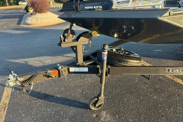 Slide: The Image of Trailer hitch and wheel of 2025 Ranger RT198P boat in parking lot. - 31