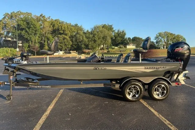 The Image of 2025 Ranger RT198P fishing boat on trailer in parking lot. - 0