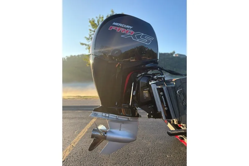 Slide: The Image of Mercury Pro XS outboard motor on 2025 Ranger RT198P boat, sunny outdoor setting. - 12