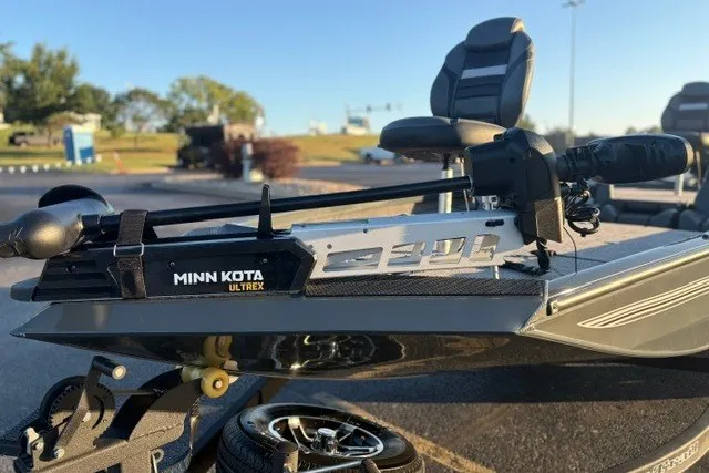 Slide: The Image of 2025 Ranger RT198P boat with Minn Kota Ultrex trolling motor in a sunny outdoor setting. - 16