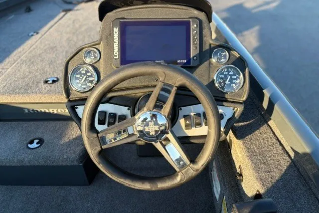Slide: The Image of 2025 Ranger RT198P boat dashboard with steering wheel and Lowrance display. - 19