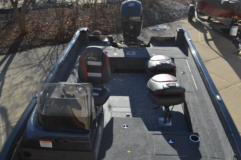 Slide: The Image of 2025 Ranger VS1882SC Angler boat interior with seating and motor. - 4