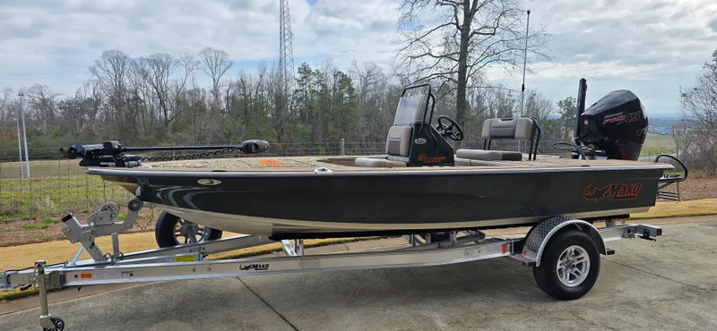 Slide: The Image of 2025 Mako 18 Pro Skiff Backwater Edition on trailer, parked outdoors. - 0