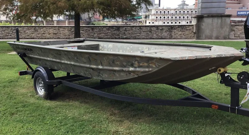 Slide: The Image of 2025 Tracker Grizzly 1754 Jon boat on trailer, parked on grass. - 19
