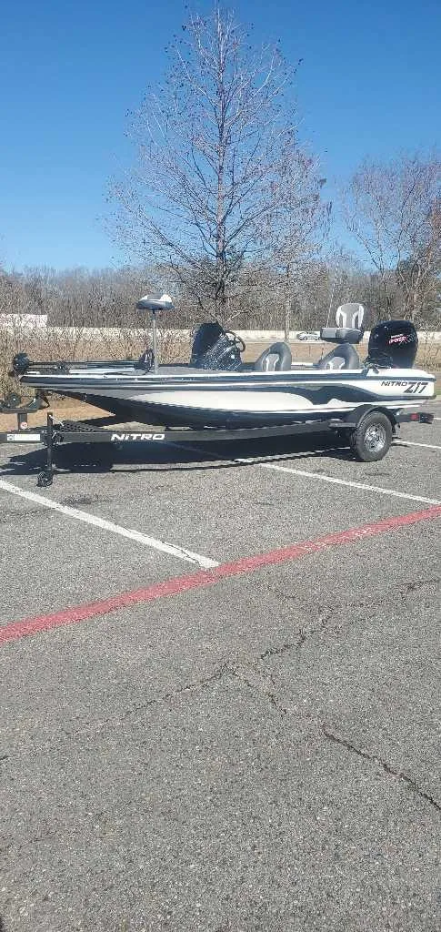 Slide: The Image of 2025 Nitro Z17 boat parked in a lot on a sunny day. - 0