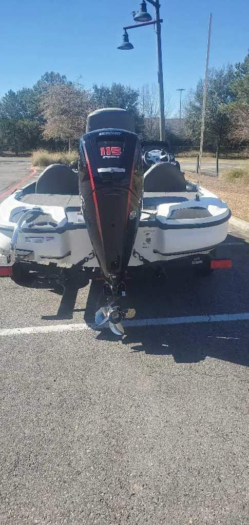 Slide: The Image of 2025 Nitro Z17 boat parked outdoors, rear view with motor visible. - 1