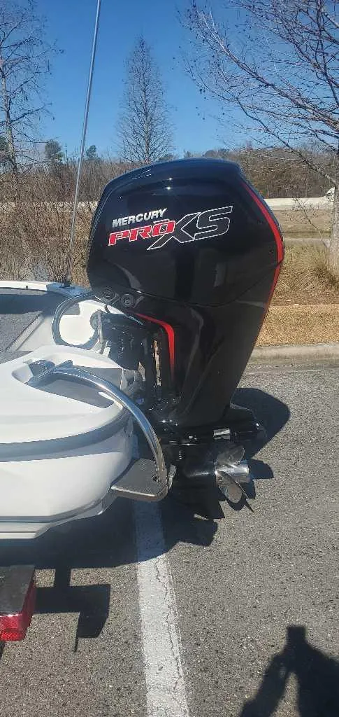 Slide: The Image of 2025 Nitro Z17 boat with Mercury Pro XS outboard motor in a parking lot. - 3