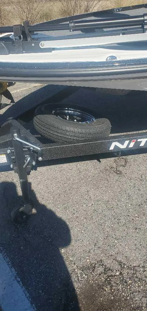 Slide: The Image of 2025 Nitro Z17 boat trailer with spare tire on asphalt. - 6