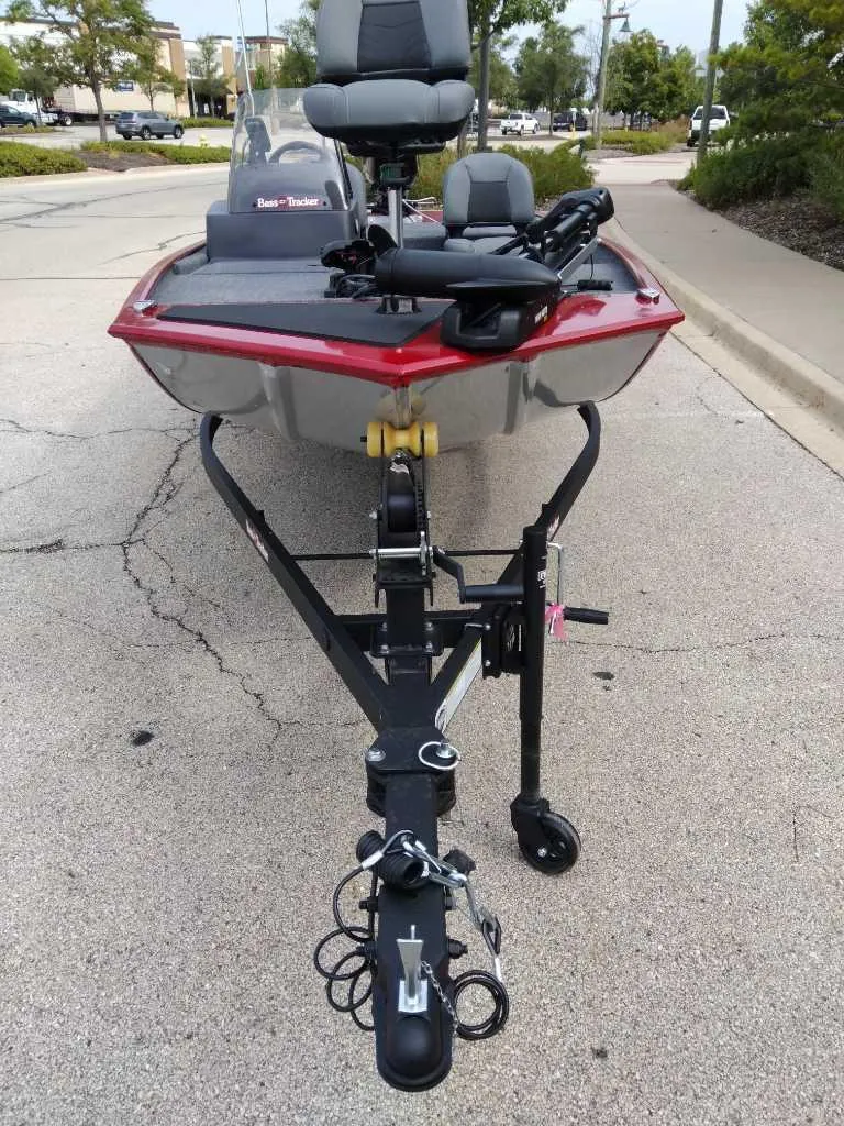 Slide: The Image of 2025 Tracker Bass Tracker Classic XL boat on trailer, parked on pavement. - 3