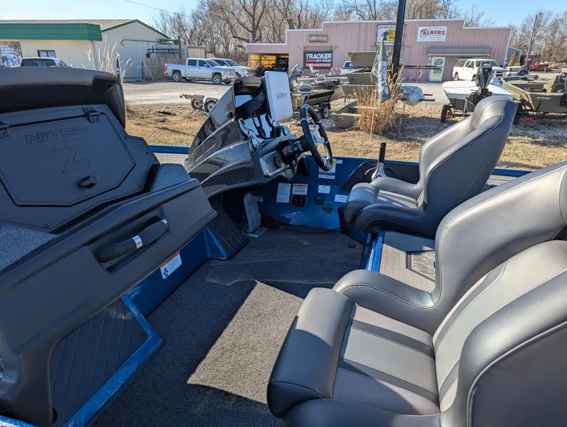 Slide: The Image of Interior of a 2025 Nitro Z20 XL Pro boat with dual seats and steering console. - 12