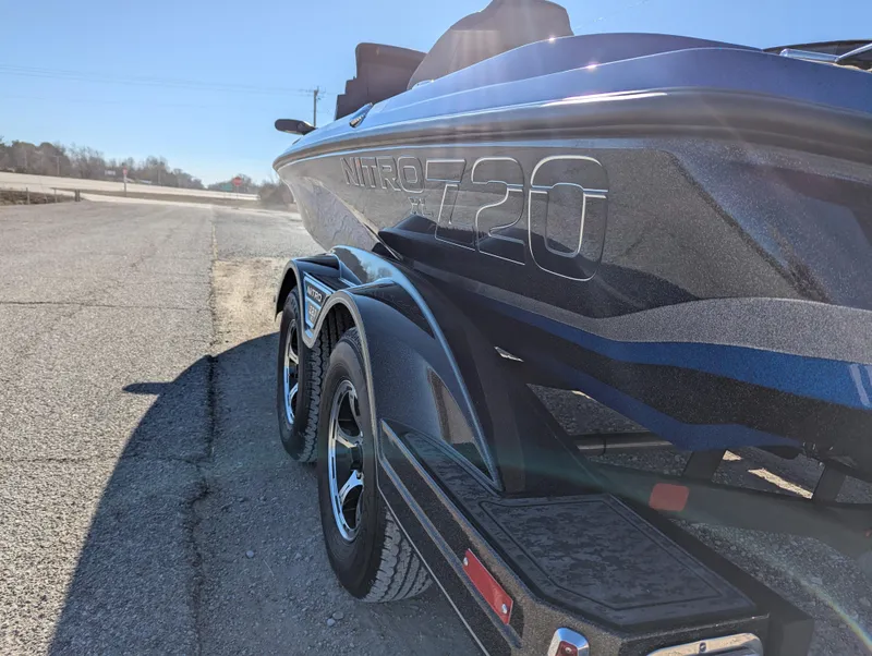Slide: The Image of 2025 Nitro Z20 XL Pro boat on trailer, parked on roadside. - 3