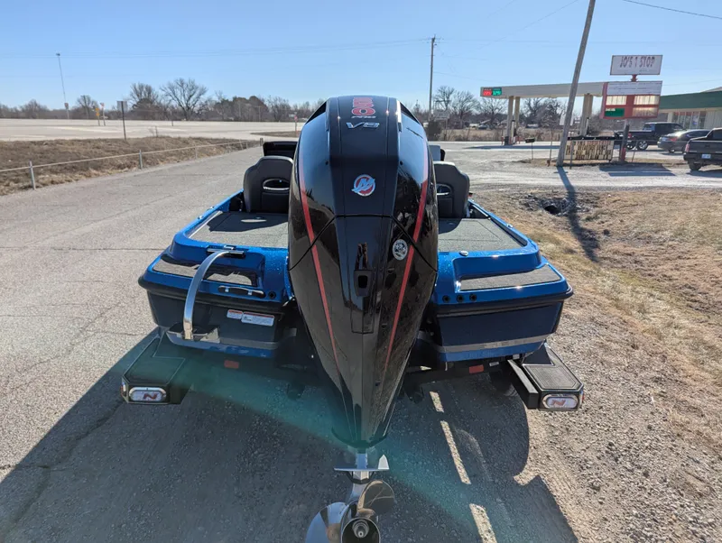 Slide: The Image of 2025 Nitro Z20 XL Pro boat with powerful outboard motor, parked on roadside. - 4