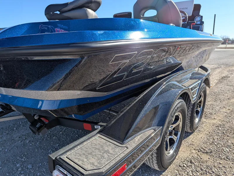 Slide: The Image of 2025 Nitro Z20 XL Pro boat on trailer, blue and black design. - 5