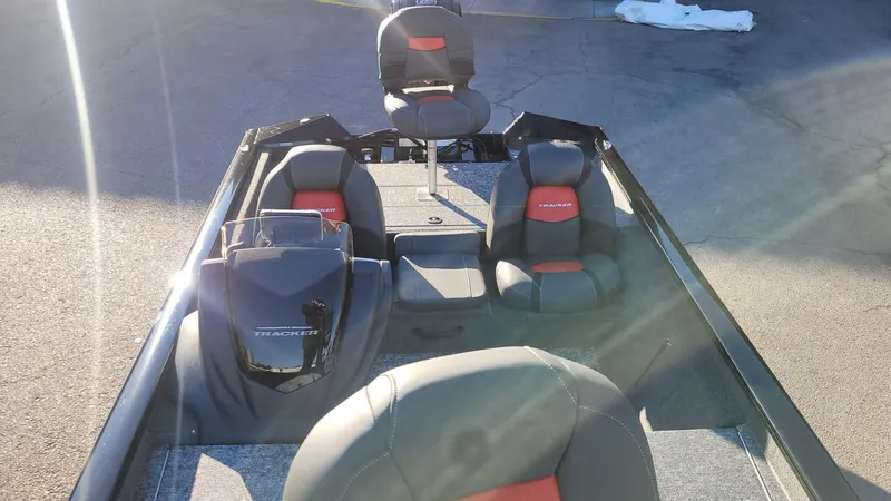 Slide: The Image of 2025 Tracker Pro Team 190 boat interior with seating and steering console. - 7