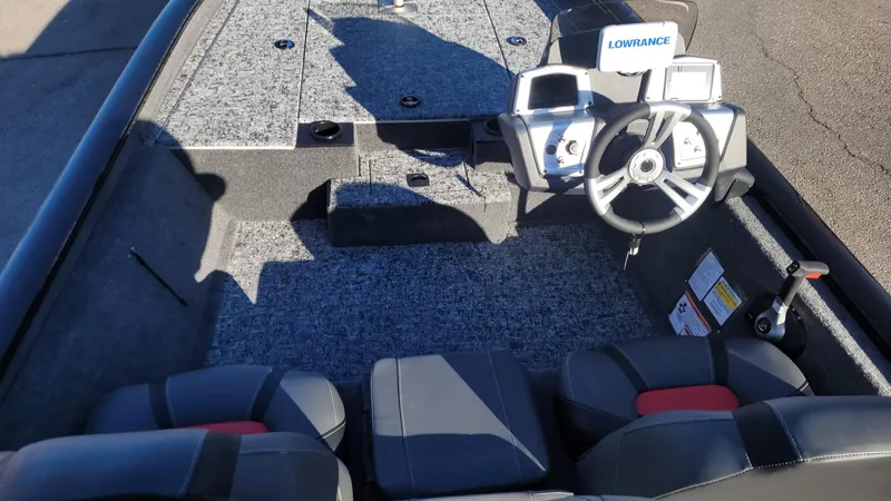 Slide: The Image of 2025 Tracker Pro Team 190 boat interior with steering wheel and seating. - 8