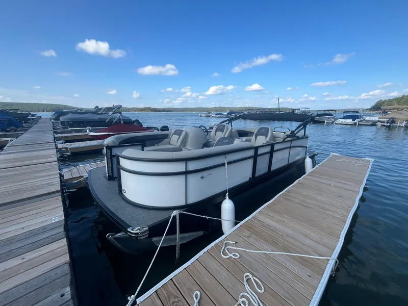 The Image of 2024 Barletta ARIA 22QC pontoon boat docked on a sunny day. - 0