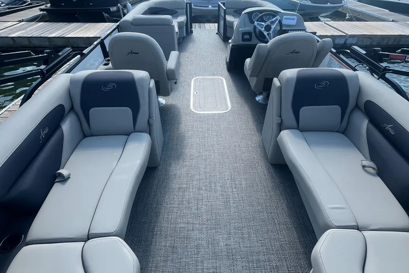 Slide: The Image of 2024 Barletta ARIA 22QC pontoon boat interior with plush seating and modern design. - 10