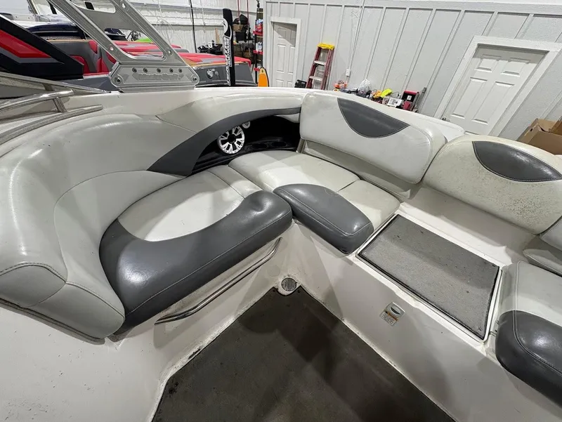 Slide: The Image of 2005 MasterCraft X-80 boat interior with gray and white seating. - 11