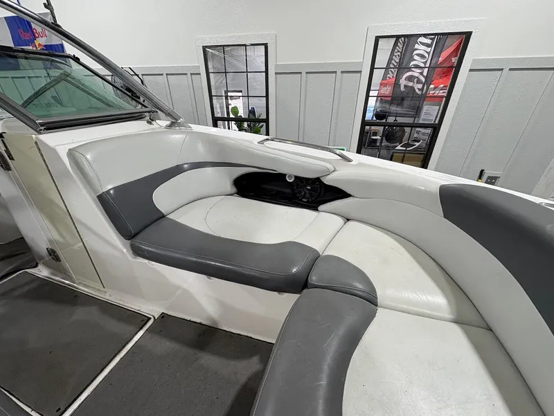 Slide: The Image of 2005 MasterCraft X-80 boat interior with gray and white seating. - 16