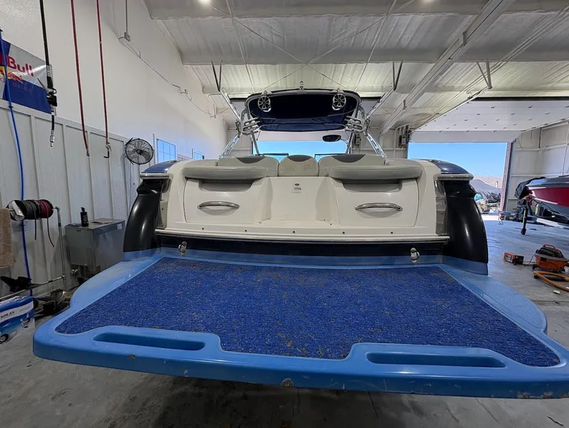 Slide: The Image of 2005 MasterCraft X-80 boat in a garage, rear view with swim platform. - 3