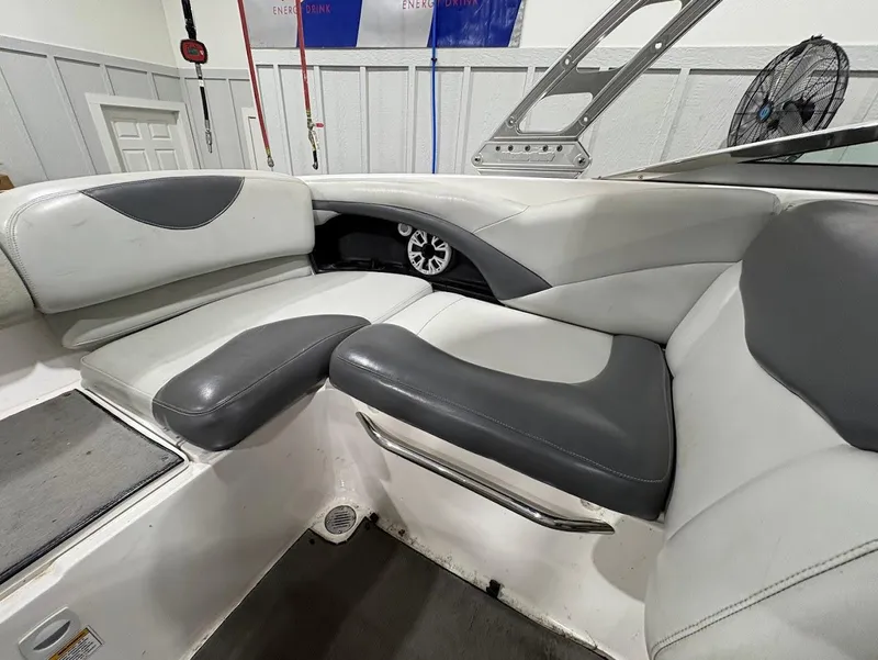 Slide: The Image of 2005 MasterCraft X-80 boat interior with gray and white seating, showcasing modern design. - 9