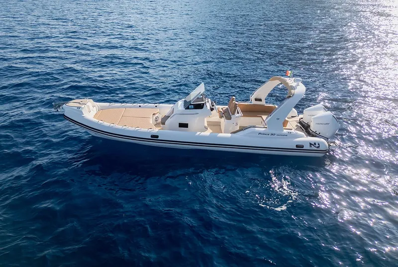 Slide: The Image of 2025 Nuova Jolly Prince 30 Exclusive boat on clear blue water. - 11