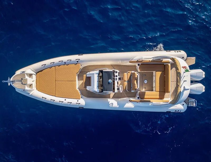 Slide: The Image of Aerial view of 2025 Nuova Jolly Prince 30 Exclusive yacht on blue ocean water. - 12