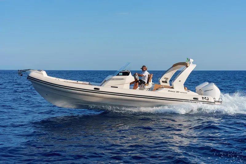 Slide: The Image of 2025 Nuova Jolly Prince 30 Exclusive boat cruising on open sea. - 14