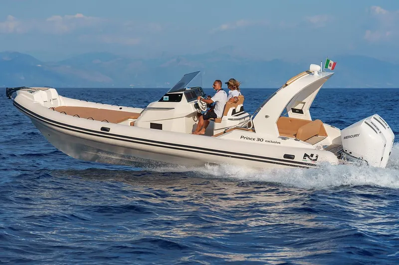 Slide: The Image of 2025 Nuova Jolly Prince 30 Exclusive boat cruising on open water. - 15