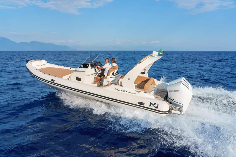 Slide: The Image of 2025 Nuova Jolly Prince 30 Exclusive boat cruising on open sea. - 16