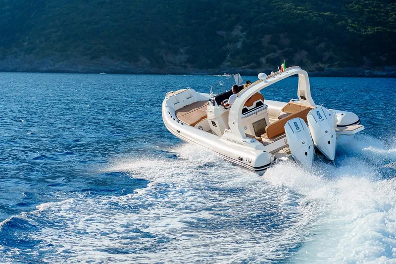 Slide: The Image of 2025 Nuova Jolly Prince 30 Exclusive cruising on blue ocean waters. - 19