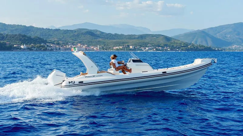 Slide: The Image of 2025 Nuova Jolly Prince 30 Exclusive boat cruising on blue ocean waters. - 20