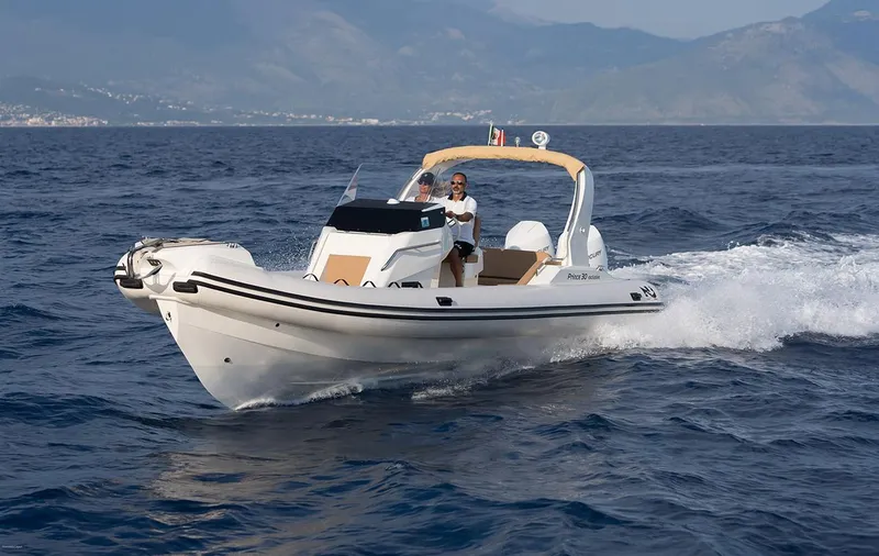Slide: The Image of 2025 Nuova Jolly Prince 30 Exclusive boat cruising on open water. - 22