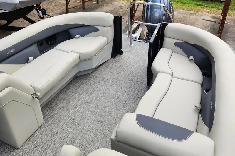Slide: The Image of 2024 Barletta Aria 24QC pontoon boat interior with plush seating and modern design. - 10