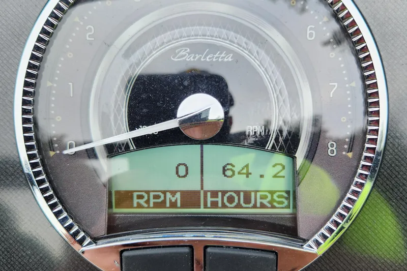 Slide: The Image of 2024 Barletta Aria 24QC dashboard showing RPM and hours. - 12