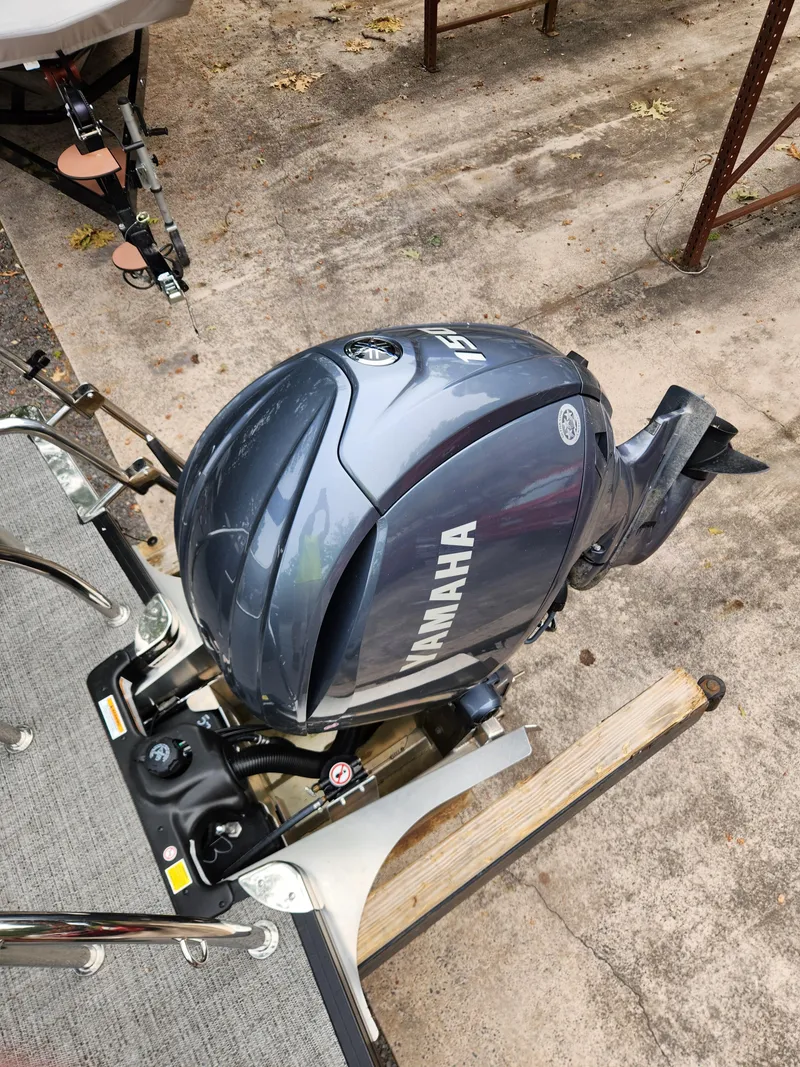 Slide: The Image of 2024 Barletta Aria 24QC with Yamaha outboard motor on a trailer. - 8