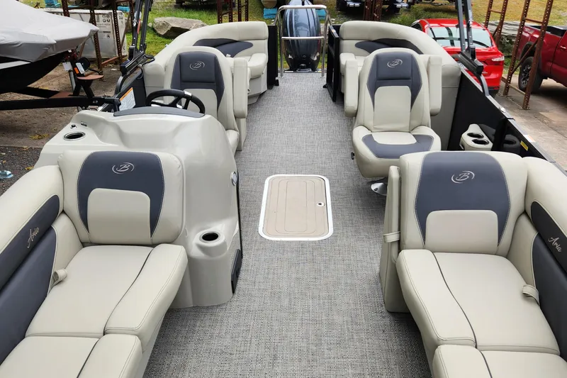 Slide: The Image of 2024 Barletta Aria 24QC pontoon boat interior with plush seating and modern design. - 9