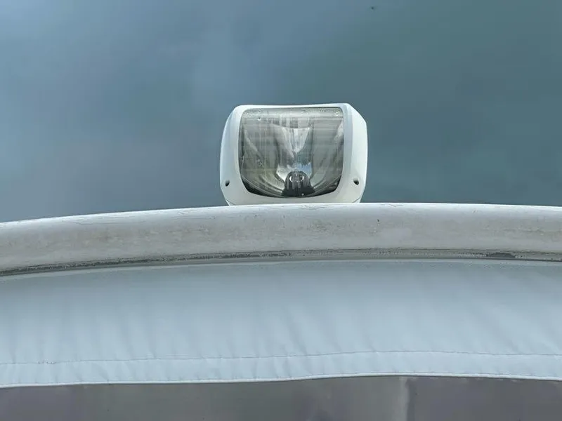 Slide: The Image of Spotlight on 1998 Post 50 Sportfish boat against cloudy sky. - 23
