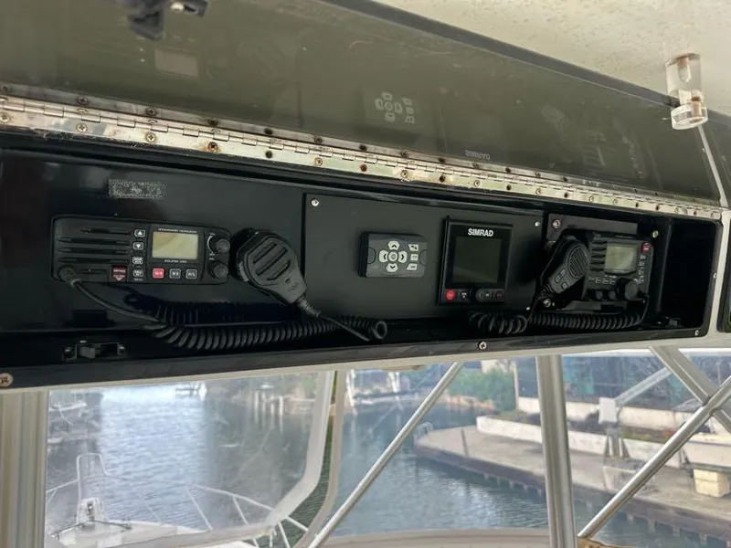 Slide: The Image of 1998 Post 50 Sportfish boat dashboard with communication equipment. - 30