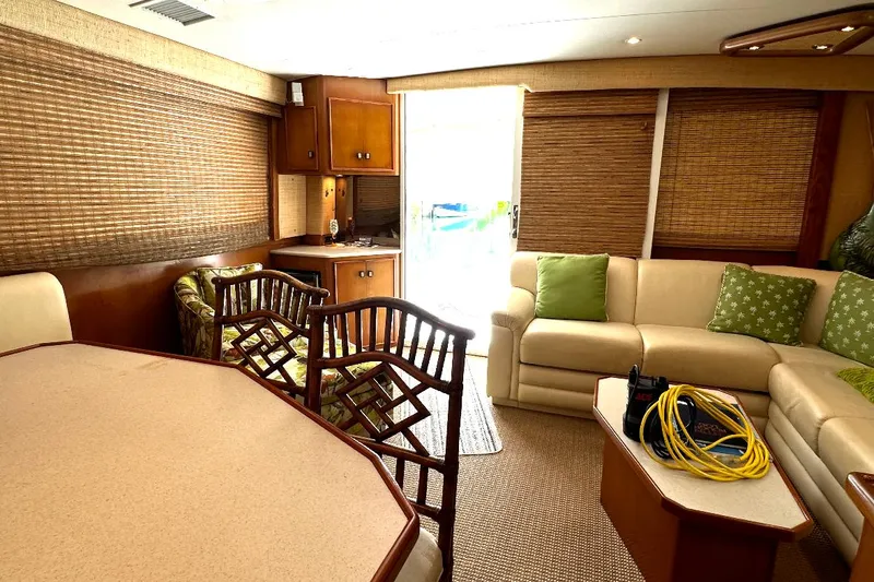 Slide: The Image of Interior of 1998 Post 50 Sportfish yacht with beige seating and wooden accents. - 45