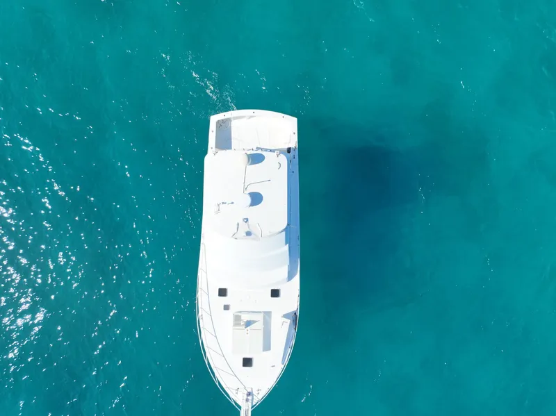 Slide: The Image of Aerial view of 1998 Post 50 Sportfish yacht on clear blue water. - 5