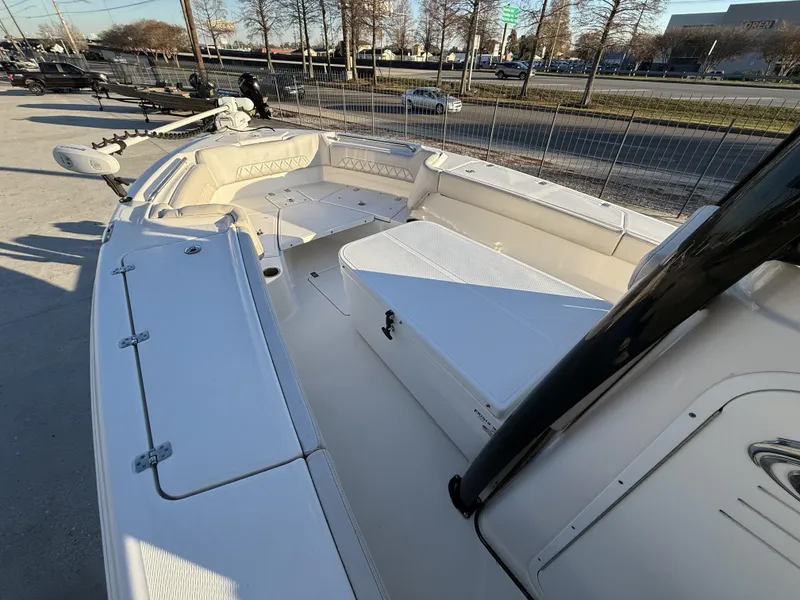 Slide: The Image of 2022 Blue Wave 2800 Makaira boat interior with seating and storage compartments. - 11