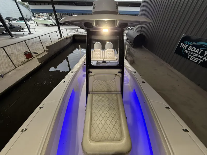 Slide: The Image of 2022 Blue Wave 2800 Makaira boat with illuminated interior and sleek design. - 13